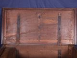 an old wooden trunk with metal straps on it