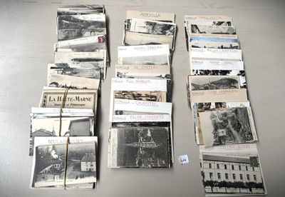 a lot of old black and white photos on the table
