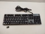 a computer keyboard and mouse sitting on a table