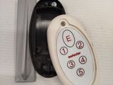 a close up of a remote control on a wall
