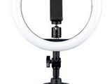 a close up of a ring light on a tripod on a white background