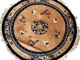 a round rug with a blue border on it
