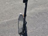 a scooter that is sitting in the parking lot