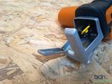 a tool that is laying on a piece of plywood