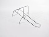 silver metal luggage rack on a white surface with a white background