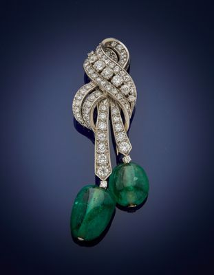 an emerald and diamond broochle, by van cleef