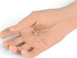 a hand that has a ring on it that has a diamond on it