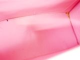 the inside of a pink purse with a zipper on it
