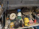 a lot of tools on a shelf in a garage