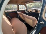 a view of the inside of a car from the driver ' s seat