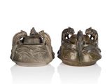 pair of chinese bronze figurines of elephants on a rock