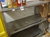 many bottles of alcohol sitting on a shelf in a room
