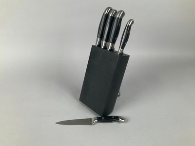 a knife and a knife block with a knife on it