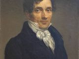 portrait of a man in a blue coat with a white bow tie