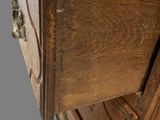 a wooden cabinet with a drawer on top of it
