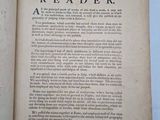 an open book on a white table with a blue background