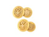 a close up of three gold buttons with a crown on them