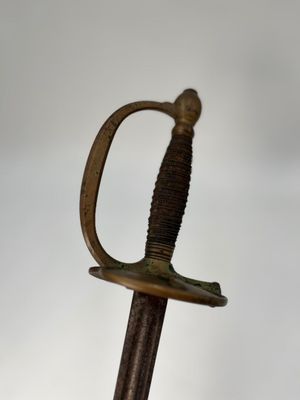 a close up of a sword on a white background