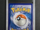 a close up of a pokemon card in a plastic case