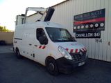 a white van that is parked in front of a building