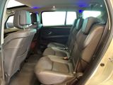 the interior of a car with two rows of seats and a center console