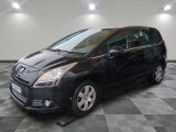 a picture of a black minivan parked in a garage