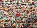 an image of a close up of a rug with birds and flowers on it