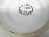 a white plate with a blue and yellow design on it