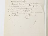 an old letter with a handwritten message on it next to a piece of paper