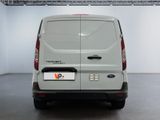 the rear of a white van is parked in a room