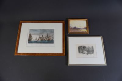 three framed pictures on the wall of a room