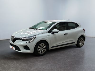 a white car in a white room with a black floor