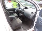 the interior of a car with the door open and the driver ' s seat down