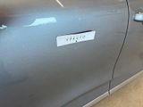 a close up of a car door with a sticker on it
