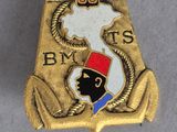 a close up of a badge on a table with a white background