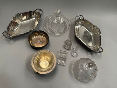 a lot of silver and glass items on the table