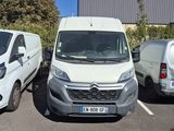 two vans parked in a parking lot next to each other