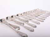a lot of spoons that are sitting on a table