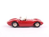 a red toy car with a white dog in it