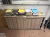 a desk with a lot of papers on it