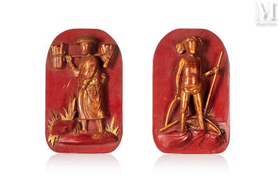 paire de figurines en jade rouge sculptées représentant un homme et une femme