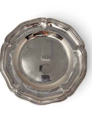 an antique silver plate on a white background with a white background