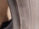 the tire of a car is shown on the side of the road