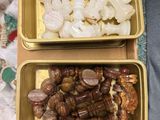 two trays of food that are sitting on a table