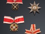 several medals are displayed on a black surface with a black background