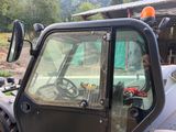 a tractor that is sitting in the dirt