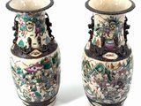 two vases sitting side by side on a white surface