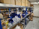 many boxes and bins on the shelves in the warehouse