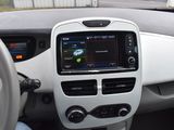 the interior of a car with a steering wheel and dashboard controls