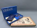 a blue box with a game in it sitting on top of a table